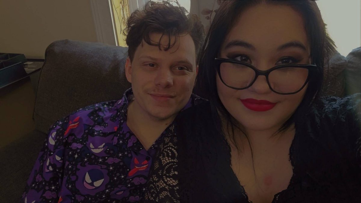 Briana and Ryan smiling together in an indoor selfie